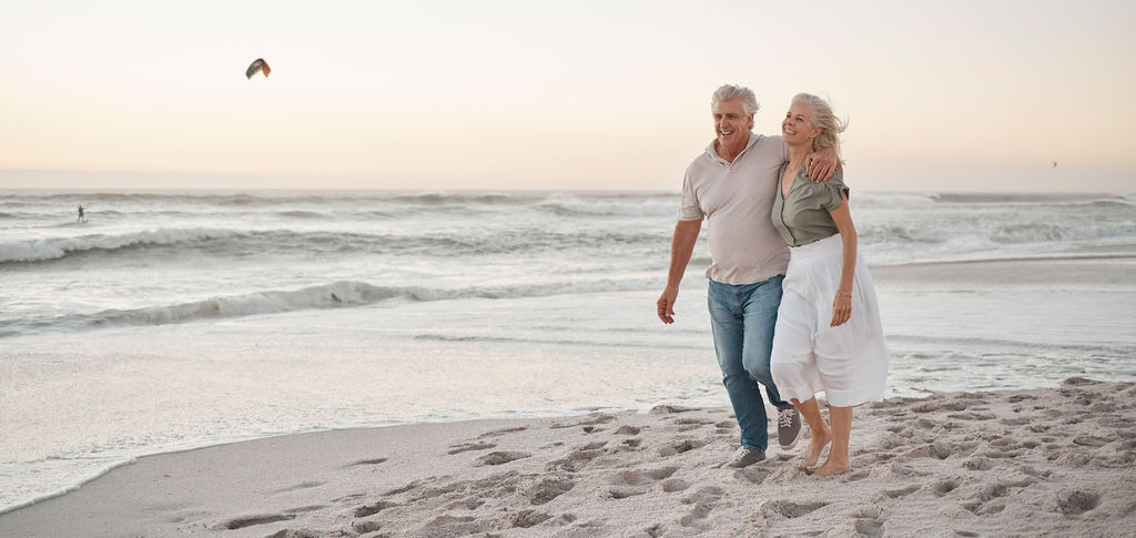 A couple enjoying retirement on the beach